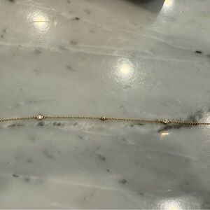 Tiffany Peretti Diamonds by the yard 18k yellow gold three diamond bracelet